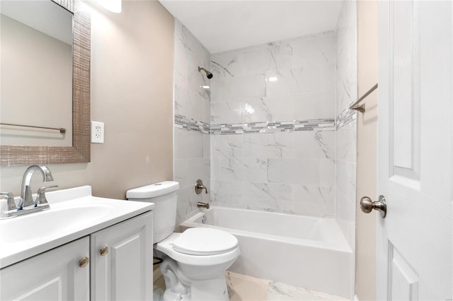 full bathroom featuring toilet, vanity, and tiled shower / bath