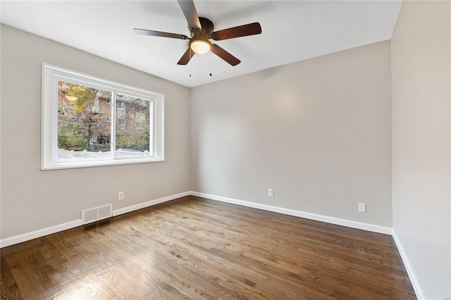 empty room featuring ceiling fan and hardwood / wood-style floors