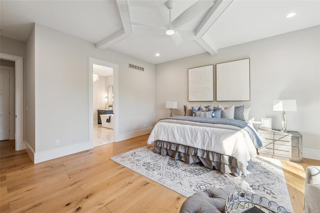 bedroom featuring ensuite bath and light hardwood / wood-style flooring