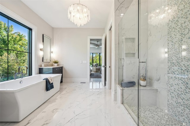 bathroom with a wealth of natural light, vanity, and shower with separate bathtub