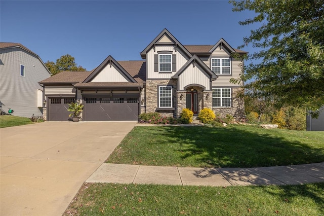 craftsman house featuring a front yard and a garage