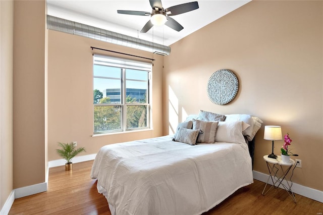 bedroom featuring ceiling fan and wood-type flooring