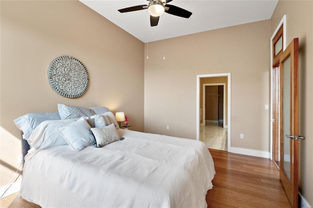 bedroom with light wood-type flooring and ceiling fan