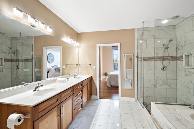 bathroom featuring vanity and a shower with shower door