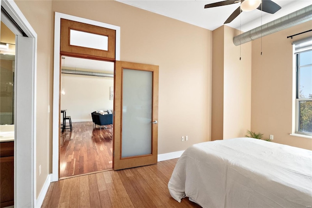 bedroom featuring ceiling fan and light hardwood / wood-style flooring