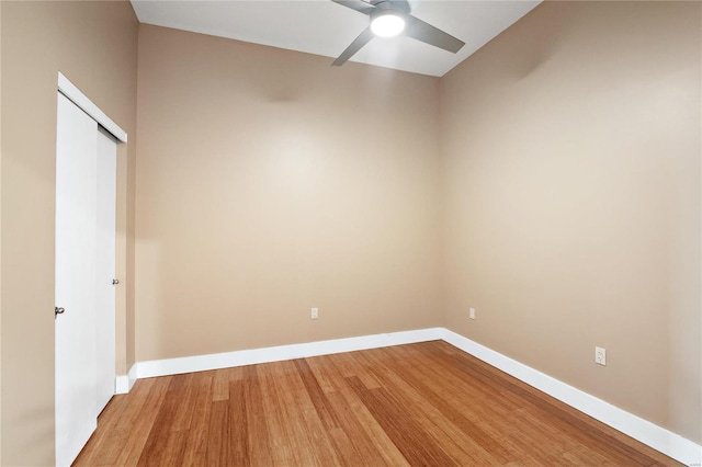 empty room featuring wood-type flooring and ceiling fan