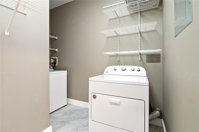 laundry area featuring washing machine and clothes dryer