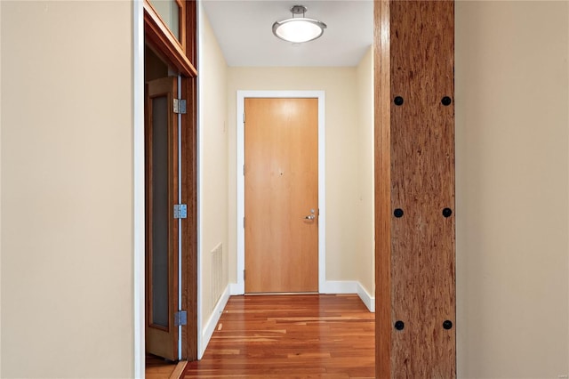 hall with light hardwood / wood-style flooring