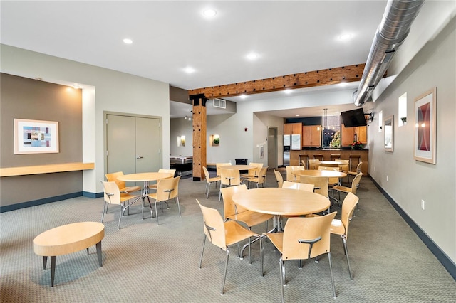 view of carpeted dining area