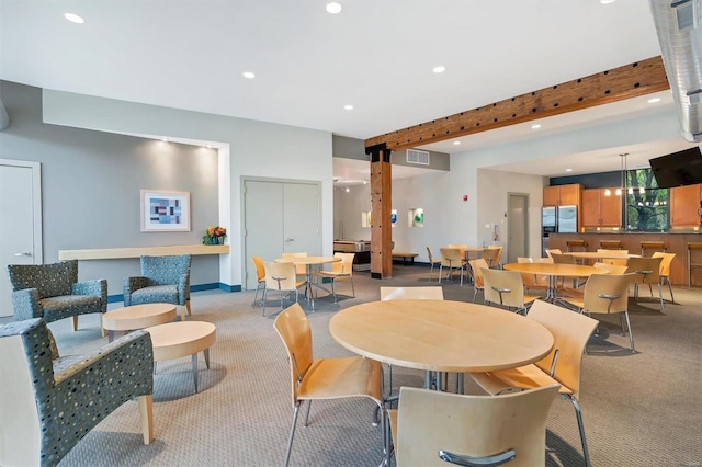 view of carpeted dining space