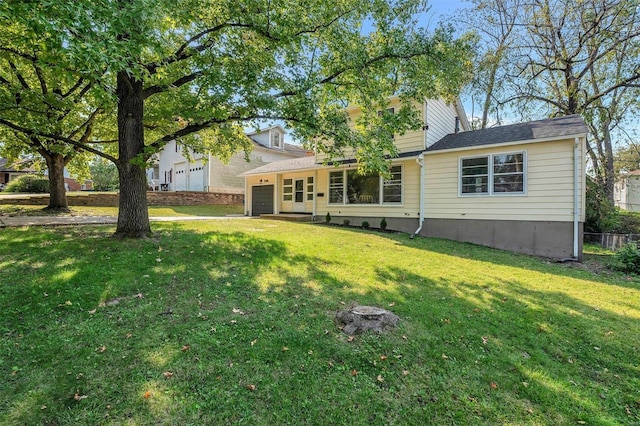 back of house with a yard