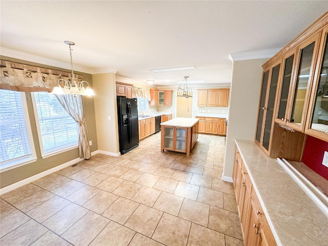 kitchen featuring black appliances, decorative light fixtures, ornamental molding, and a kitchen island