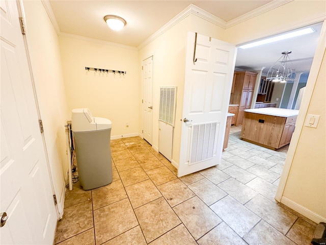 bathroom with crown molding and a chandelier