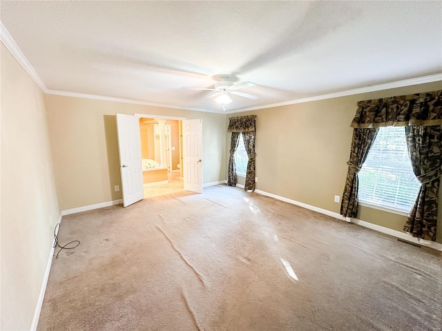 unfurnished bedroom featuring ceiling fan, connected bathroom, ornamental molding, carpet, and a textured ceiling