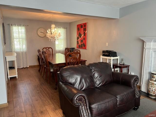 dining space with a chandelier and hardwood / wood-style floors