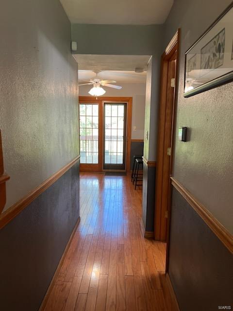 hall with light hardwood / wood-style flooring