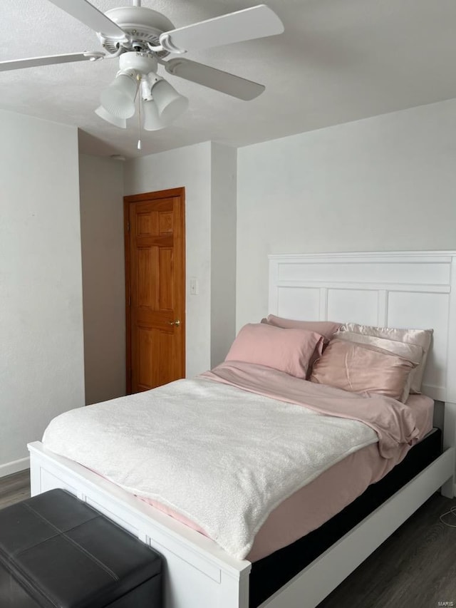 bedroom featuring dark hardwood / wood-style floors and ceiling fan