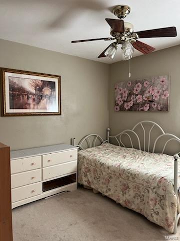 bedroom with light colored carpet and ceiling fan