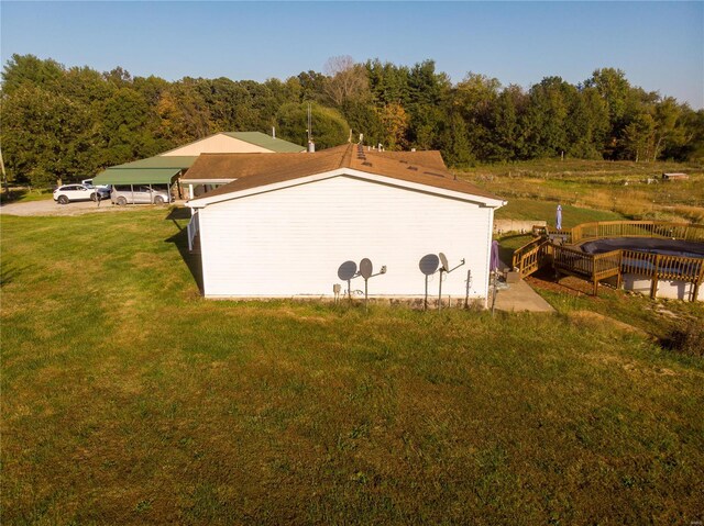 view of storm shelter featuring a yard