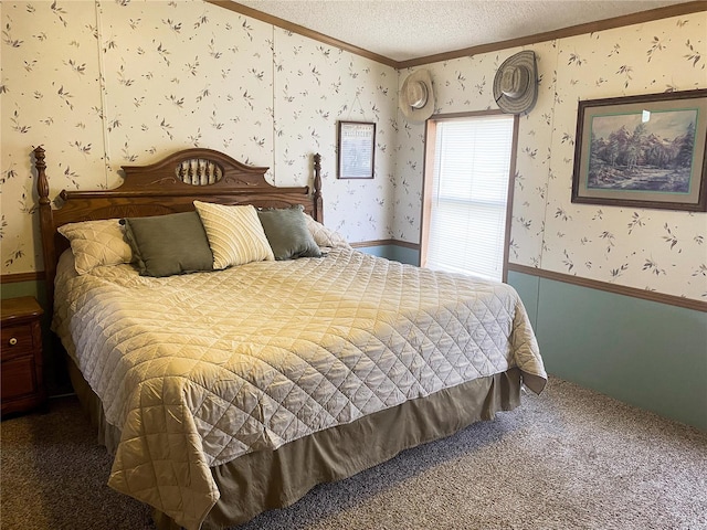 bedroom featuring dark colored carpet, crown molding, and a textured ceiling