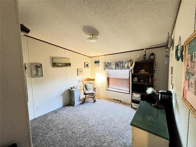 living area featuring crown molding, carpet, and a textured ceiling