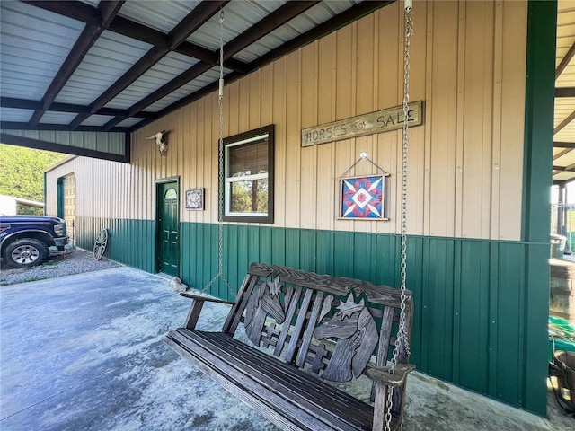 view of side of property featuring a carport