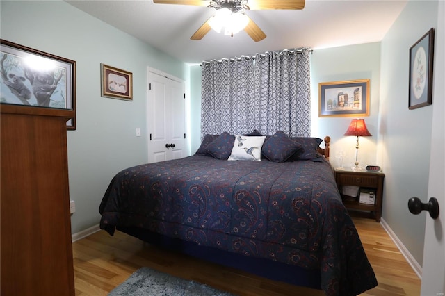 bedroom featuring light hardwood / wood-style floors and ceiling fan