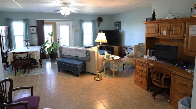 living room with french doors, light tile patterned floors, and ceiling fan