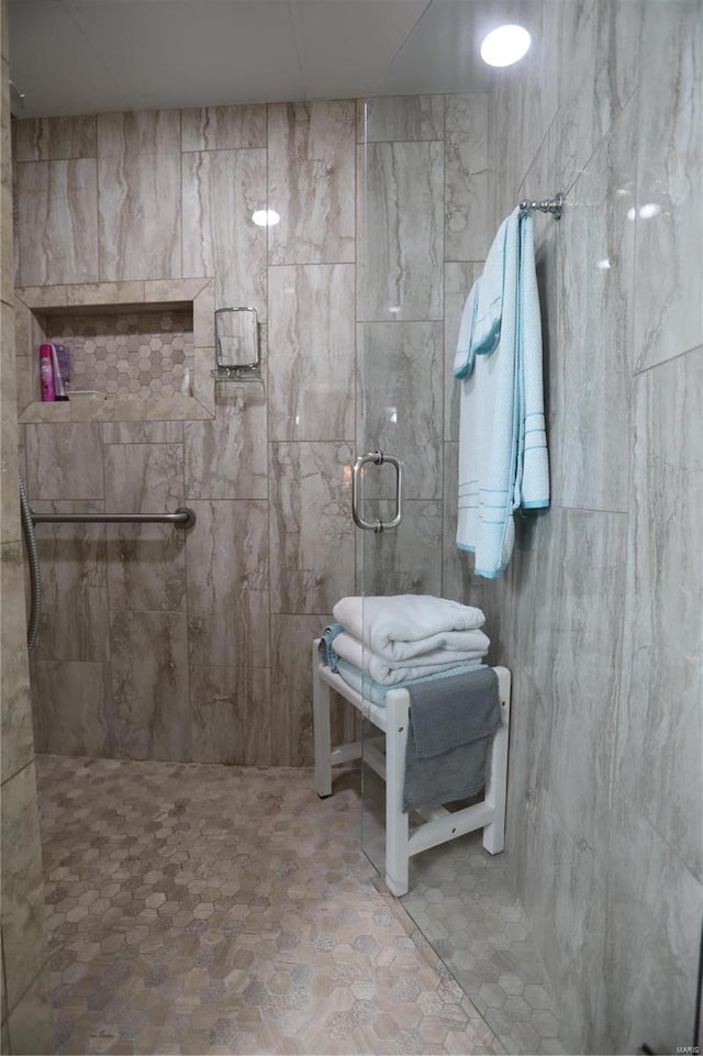 bathroom with a tile shower