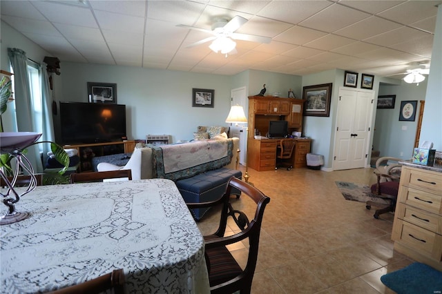 dining space featuring light tile patterned flooring and ceiling fan