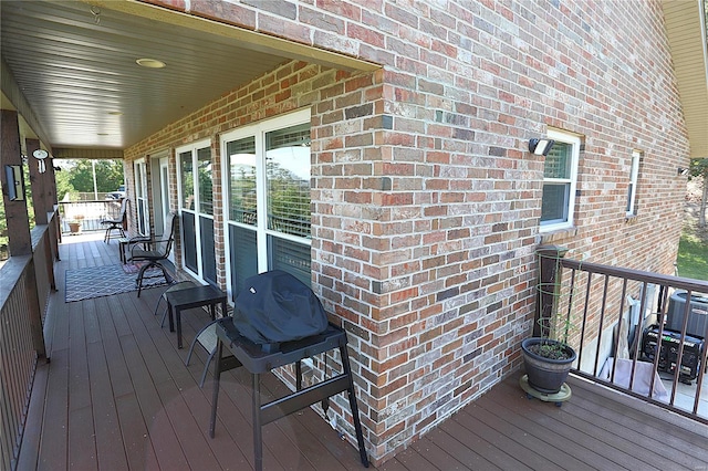 wooden terrace featuring grilling area