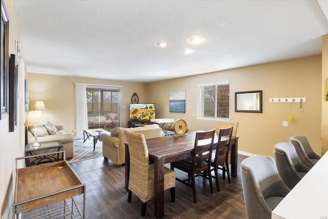 dining room with dark wood-type flooring