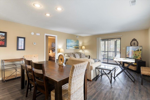 dining area with dark hardwood / wood-style flooring