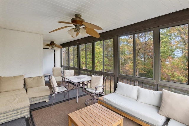 sunroom featuring ceiling fan and a healthy amount of sunlight