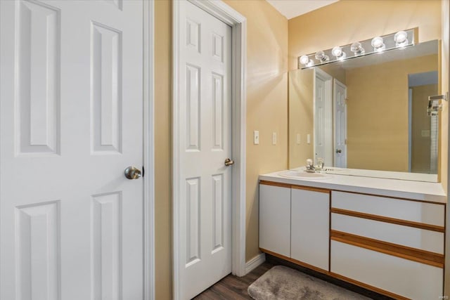 bathroom with vanity and hardwood / wood-style flooring