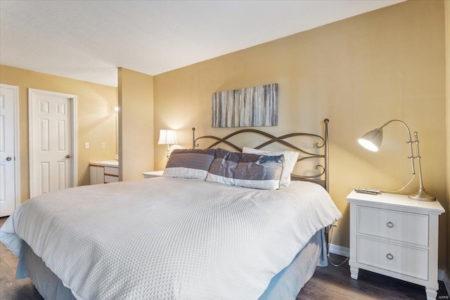 bedroom featuring dark hardwood / wood-style floors