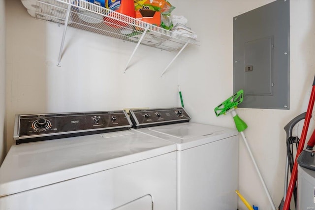 laundry room featuring electric panel and washer and dryer