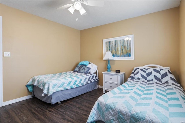 bedroom featuring ceiling fan and dark hardwood / wood-style floors