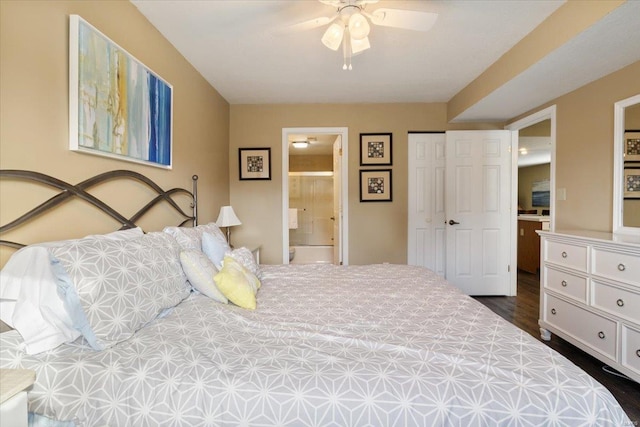 bedroom with dark wood-type flooring, ensuite bathroom, and ceiling fan