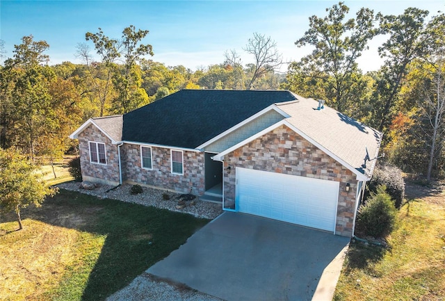 view of front of home featuring a front yard and a garage