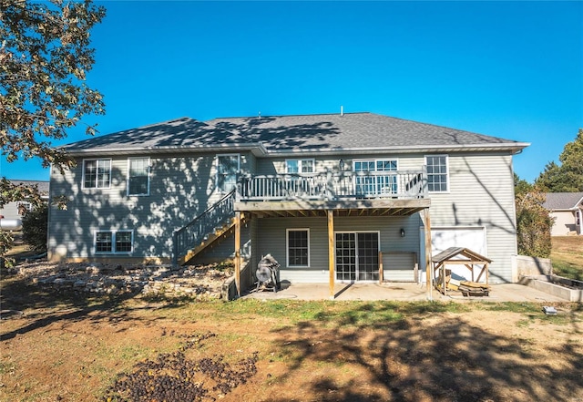 back of house featuring a patio area, a yard, and a deck