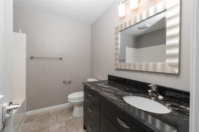 bathroom with toilet and vanity