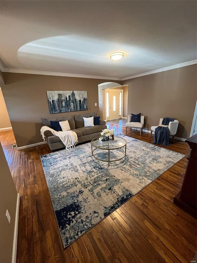 living room with crown molding and dark hardwood / wood-style floors