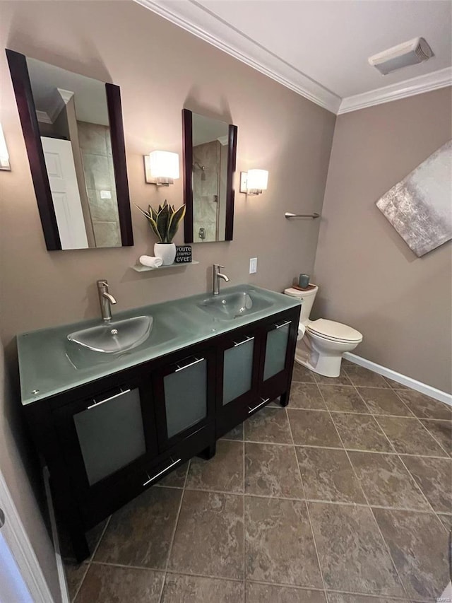 bathroom featuring toilet, crown molding, vanity, and a shower