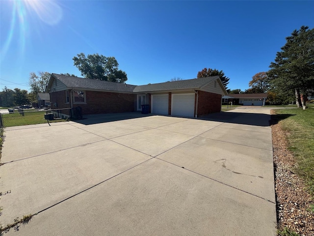 view of front of home featuring a front yard and a garage