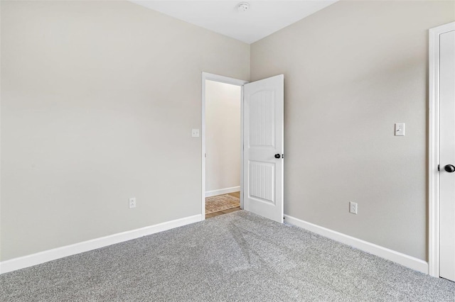 unfurnished room featuring carpet floors