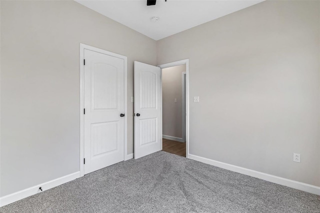 unfurnished bedroom with carpet floors