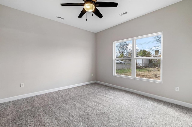 unfurnished room with ceiling fan and carpet flooring