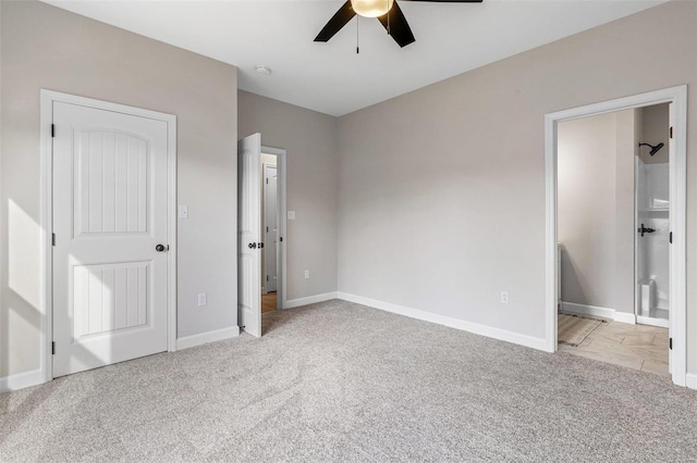 unfurnished bedroom featuring light colored carpet and ceiling fan