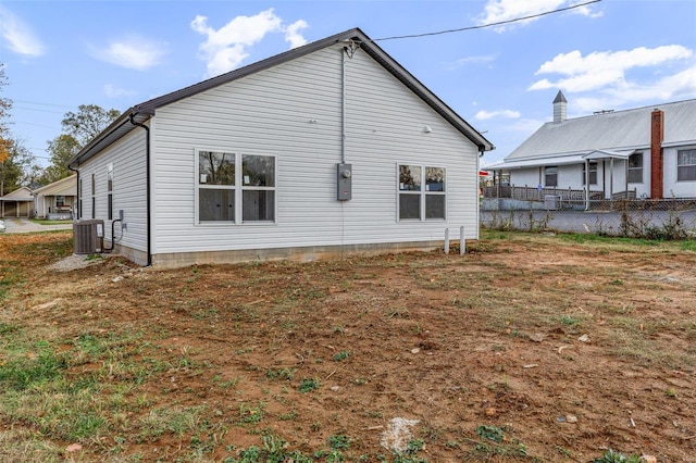 rear view of house with cooling unit